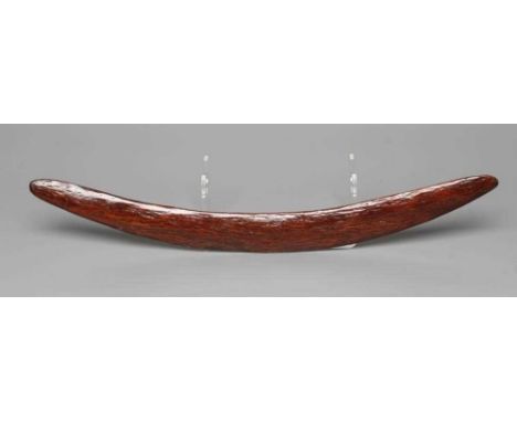 AN ABORIGINAL BOOMERANG with one flat edge and long tooling marks throughout, old label inscribed "Murchison River District(?
