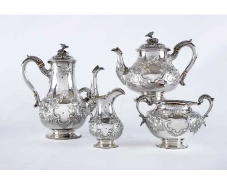 A VICTORIAN SILVER FOUR PIECE TEA AND COFFEE SERVICE, maker Hands & Son, London 1863, of baluster form with beaded acanthus l