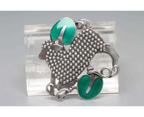 A GEORG JENSEN SILVER BROOCH designed by Arno Malinowski, cast as a lamb with beaded fleece and two green enamelled large sty