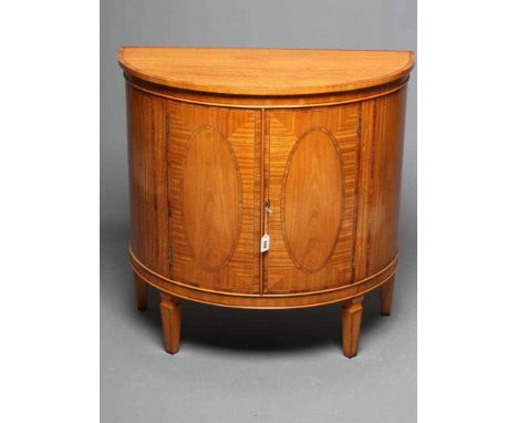 A SATINWOOD COMMODE, 20th century, of demi lune form with rosewood banding and ebony and box stringing, two doors each with a