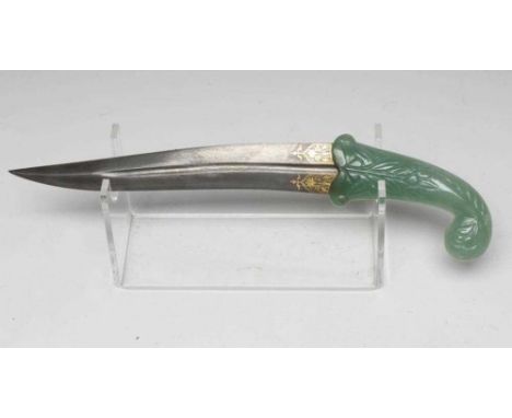 A MUGHAL TYPE DAGGER, the 10 1/8" serpentine blade inlaid with gold metal flowers, the typical jade grip carved with flowers,