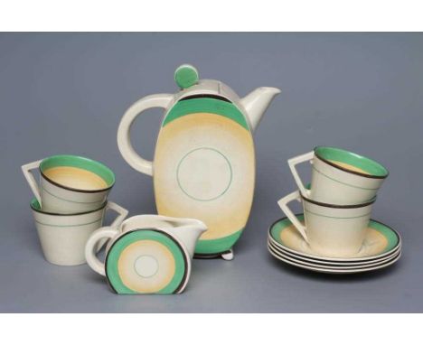 AN ART DECO CLARICE CLIFF WILKINSON POTTERY BONJOUR PART COFFEE SERVICE, with green, yellow and black concentric circle decor
