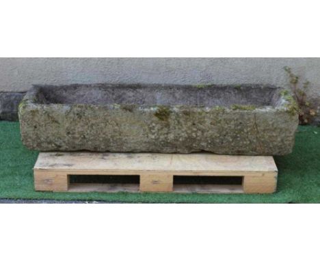 A SANDSTONE TROUGH of rough hewn narrow oblong form, 58" x 16" x 11" (Est. plus 24% premium inc. VAT)Condition Report: Good o