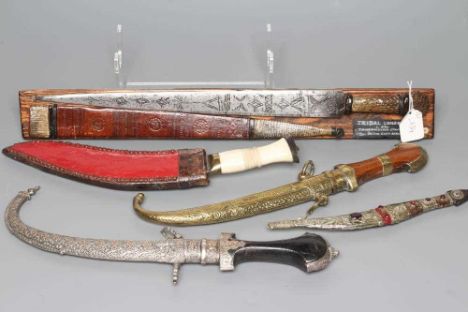 FIVE DAGGERS, comprising a civilian kukri with bone handle, a Tanzanian Tribal long knife with etched blade, a Moroccan Jambi