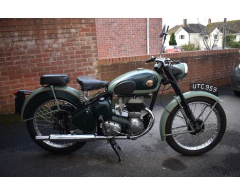 A 1955 BSA C10L, registration number UTC 959, green.  When the C10 reappeared after the WWII, its oil was no longer contained