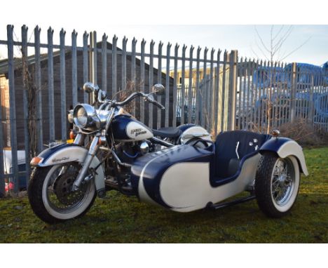 A 1996 Harley Davidson Heritage Softail Classic sidecar combination, French registered, frame number 1HD1BJL43KY015257, blue 