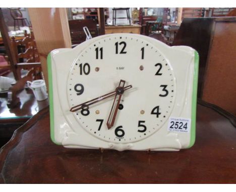 A retro ceramic 8 day wall clock.