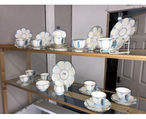 A set of Aynsley tea ware, circa 1930's, with blue butterfly handle,12 cups, 12 saucers, 12 sides, 1 cake, 1 cream &amp; 1 su