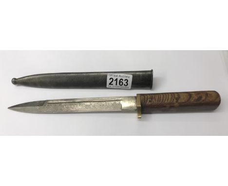 A WW2 German dress bayonet short blade, double engraved with two Panzers on blade with original scabbard (handle grip has bee