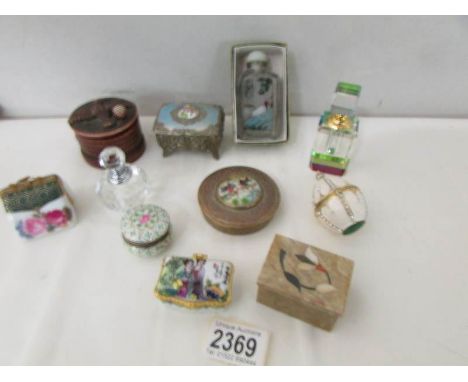 A mixed lot of trinket boxes and scent bottles.