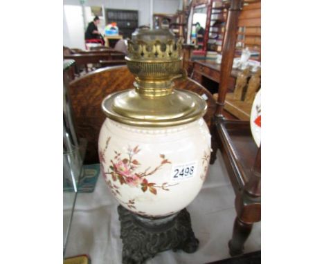 A metal and ceramic oil lamp base.