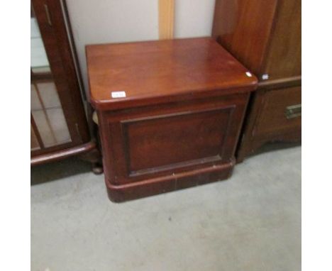 An old mahogany commode (missing pot).
