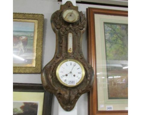 A Cast iron barometer, a/f (glass is broken).