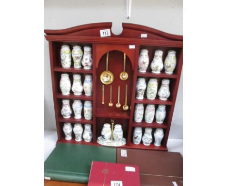 A Lenox porcelain spice rack collection including 24 spice jars, salt and pepper and spoons, featuring birds and blossoms