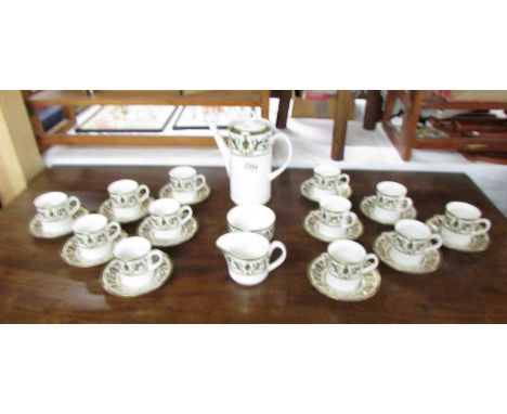 A Royal Worcester coffee set comprising 12 coffee cans, 12 saucers, coffee pot, sugar basin and cream jug.