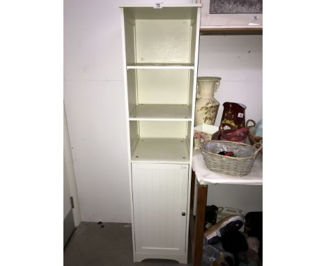 A white finished bathroom shelf unit with cupboard