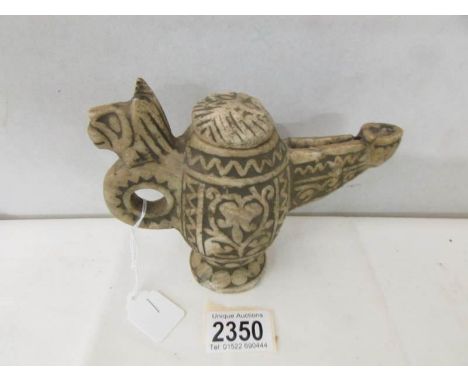 Islamic Ghaxni stone carved oil lamp: A rare carved stone oil lamp from Ghazni, Afghanistan, late 19th century.  A large oil 