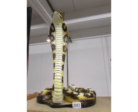 A ceramic cobra (damage to neck).