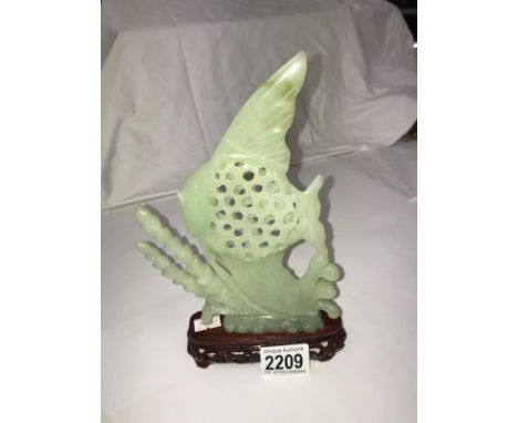 An angel fish on stand,(Fin A/F) possibly jade but we would advise viewing to satisfy yourself