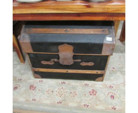 A good quality dome top travel trunk with interior.