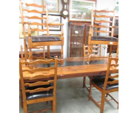A set of 6 oak ladder back chairs comprising 2 carvers and 4 dining.