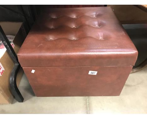 A leather covered storage box/foot stool/pouffe