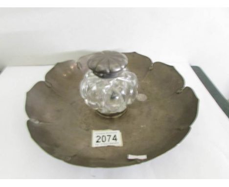 A silver and glass inkstand in the form of a flower, hall marked Samuel Hunt, London 1860.  Also marked 'Hunt &amp; Foskell l