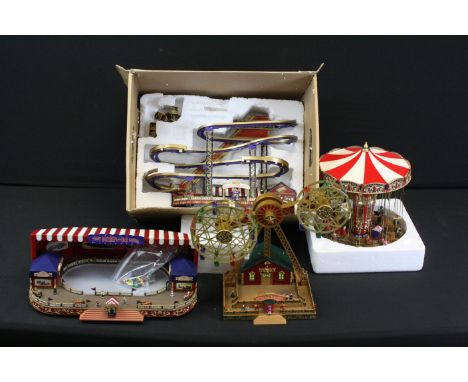 Four Gold Label fairground models to include Roller Coaster, Ferris Wheel, Bump and Go Racers and Carousel, contained within 