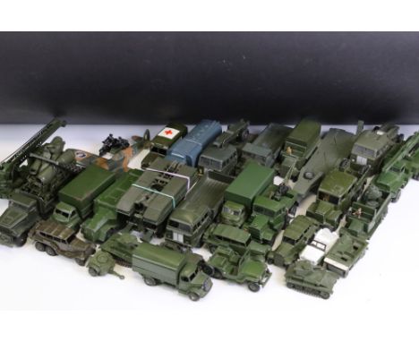 Around 45 Dinky mid 20th C military diecast models to include Tous Terrains Berliet, 719 Spitfire MkII, Supertoys 642 Pressur