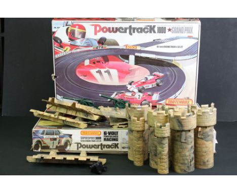 Two Boxed Matchbox Powertrack slot car racing sets to include Grand Prix 1000 and Super Sport 3000 (each with two slot cars a