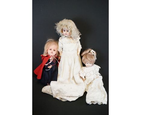 Early 20th C Heubach Koppelsdorf doll with sleeping blue eyes, teeth and original outfit featuring red cape, chip to foot.toe