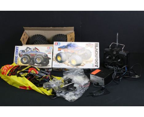 Tamiya 1/10 scale R/C monster truck with Blackfoot chassis and Custom F150 black body, with battery pack, Futaba Attack-R con