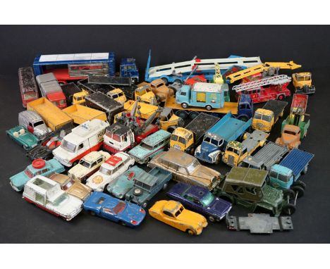 Over 40 mid 20th C play worn diecast models to include Dinky, Corgi, Matchbox, Britains and Budgie examples, featuring Corgi 