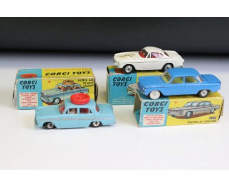 Three boxed Corgi diecast models to include 229 Chevrolet Corvair in pale blue with yellow interior and chrome hubs, 236 Moto