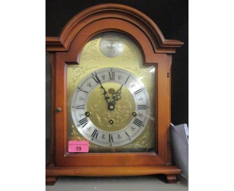 A Rapport London reproduction walnut cased mantel clock 