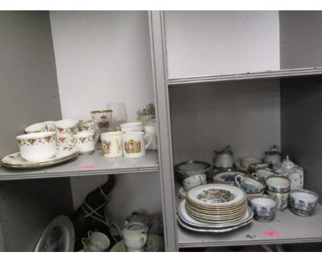 A mixed lot of china to include a Staffordshire part coffee set, commemorative mugs and a mid 20th century part tea service d