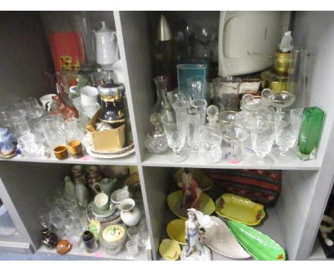 A large mixed lot of domestic glass, household items and ornaments to include a Victorian brass oil lamp, a lava lamp, cut gl