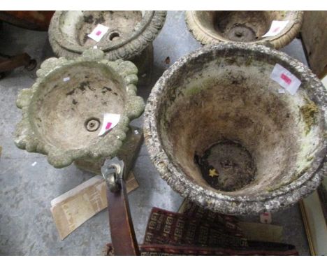 Two composition planters to include a large planter having floral and mask decoration 20"h x 22"w 