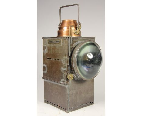 A large copper-topped signal lamp stamped, S.R complete with burner