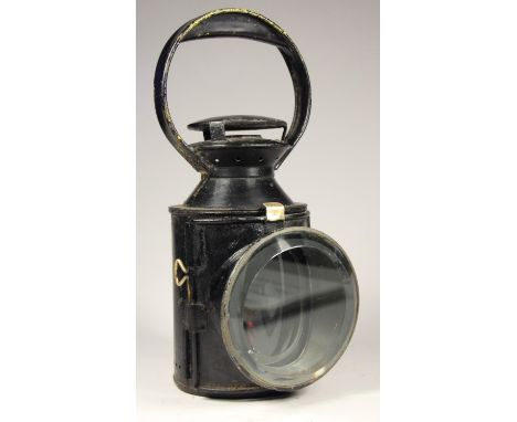 A London Transport 4 aspect hand lamp, body stamped L.T. complete with burner and glasses