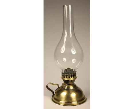 A signal-box lamp with brass reservoir/ burner and a fluted clear glass shade, height 35 cm