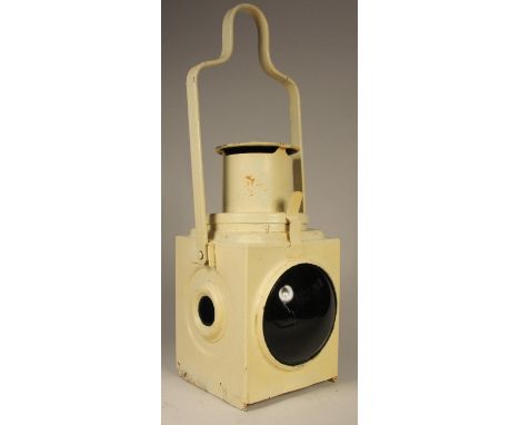 A white unmarked tail lamp, complete with burner