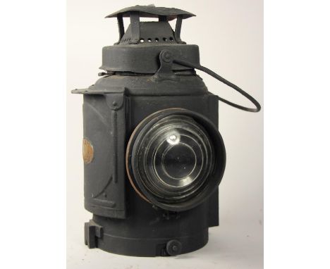 An ADLAKE non-sweating lamp with brass plaque "LMS Railway"