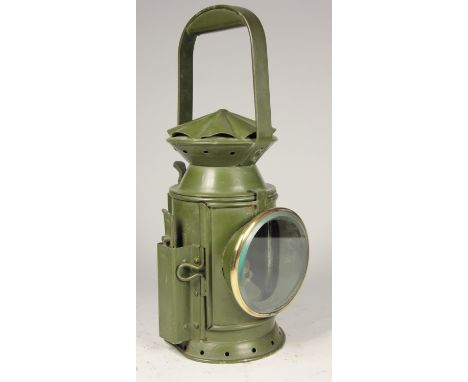 A WD 1956 dark green 3 aspect hand lamp, body stamped with arrow and date, complete with burner 