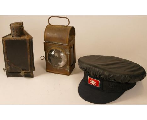 An LNER hand lantern with burner, stamped LNER, together with an unmarked triangular lamp with burner and a B.R. cap with clo