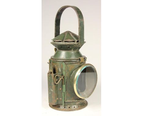 A WD 1945 dark green 3 aspect hand lamp, body stamped with arrow and date, complete with burner and glasses 