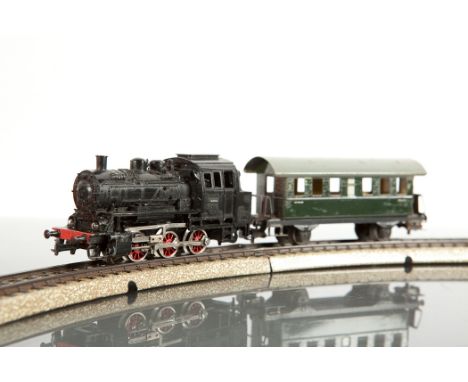 MARKLIN MODEL RAILWAY SET  circa 1959 with a transformer, coaches, trucks, vans, tanker wagons, track, buffers, signal and po