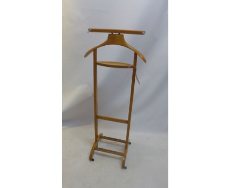A mid 20th century light oak valet.