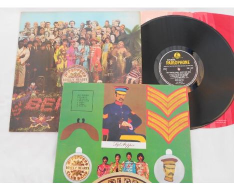 The Beatles Sgt Peppers UK 1st press LP record PMC 7027 XEX 637-1 and XEX 638-1 EX The vinyl is in excellent condition with a