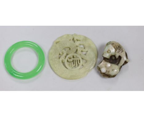 A Chinese hardstone carved roundel, a ring and a fish panel, roundabout 7cm diameter